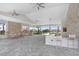 Community outdoor kitchen and seating area with bar for entertaining guests at 31426 Ancient Sage Rd, Wesley Chapel, FL 33545