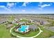 An aerial view shows the community pool, playground, and clubhouse amenities in a lush, Gathering-friendly setting at 31426 Ancient Sage Rd, Wesley Chapel, FL 33545