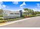 A welcoming entrance sign to the community, enhanced by colorful landscaping and greenery at 31426 Ancient Sage Rd, Wesley Chapel, FL 33545