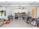 Spacious garage with epoxy floors and ample storage and room for working on projects at 31426 Ancient Sage Rd, Wesley Chapel, FL 33545