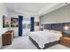 Stylish main bedroom showcasing a modern design with an upholstered headboard and modern furnishings at 31426 Ancient Sage Rd, Wesley Chapel, FL 33545