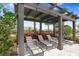 Shaded lounge area by the community pool, providing a relaxing retreat at 31426 Ancient Sage Rd, Wesley Chapel, FL 33545