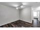 Cozy bedroom boasts hardwood flooring and a well-lit atmosphere at 36243 Lake Chase Blvd # 102, Zephyrhills, FL 33541