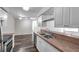 Inviting kitchen with stainless steel sink, durable countertops, and modern appliances at 36243 Lake Chase Blvd # 102, Zephyrhills, FL 33541