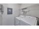 Functional laundry area equipped with a washer, dryer, and practical storage solutions at 36243 Lake Chase Blvd # 102, Zephyrhills, FL 33541