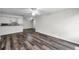 Bright living room boasts hardwood flooring and flows into the kitchen for seamless entertaining at 36243 Lake Chase Blvd # 102, Zephyrhills, FL 33541