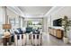 Comfortable living room featuring tile flooring, recessed lighting, and sliding glass doors leading to the outdoors at 3840 Consolare Ct, Wesley Chapel, FL 33543