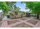 A charming backyard with brick pavers and green landscaping at 3909 W Lemon St, Tampa, FL 33609