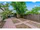 Inviting backyard with brick-paved space and partial fencing at 3909 W Lemon St, Tampa, FL 33609