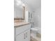 Bright bathroom featuring a shower/tub combination and updated vanity at 3909 W Lemon St, Tampa, FL 33609