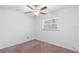 Cozy bedroom features a ceiling fan and a bright window at 3909 W Lemon St, Tampa, FL 33609