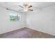 Cozy bedroom features a ceiling fan and a bright window at 3909 W Lemon St, Tampa, FL 33609