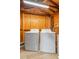 Convenient laundry room featuring modern washer and dryer units and ample storage at 3909 W Lemon St, Tampa, FL 33609