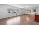 The bright living room features wood floors, fresh paint, modern lighting, and plenty of natural light at 3909 W Lemon St, Tampa, FL 33609