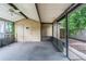 Relaxing screened porch with ceiling fan and access to the backyard, perfect for outdoor entertaining at 3909 W Lemon St, Tampa, FL 33609
