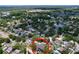 Aerial view of property location among neighborhood houses with a convenient location near ponds and schools at 4030 Braesgate Ln, Tampa, FL 33624