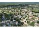 Expansive aerial view of a suburban neighborhood with mature trees and some homes featuring private pools at 4030 Braesgate Ln, Tampa, FL 33624