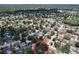 Bird's eye view of home location amid neighborhood houses, mature landscaping, and neighborhood pools at 4030 Braesgate Ln, Tampa, FL 33624