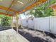 Cozy deck space leading to a garden with a beautiful fountain and well-manicured landscaping at 4030 Braesgate Ln, Tampa, FL 33624
