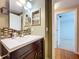 Bathroom featuring a modern vanity with mosaic backsplash and stylish decor, leading to another room at 4030 Braesgate Ln, Tampa, FL 33624