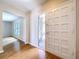 Entryway featuring hardwood floors, bright light, and views of the living room at 4030 Braesgate Ln, Tampa, FL 33624