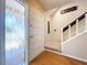 Entryway featuring hardwood floors and view of staircase at 4030 Braesgate Ln, Tampa, FL 33624