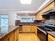 Kitchen showing stainless steel appliances, granite countertops, light wood cabinetry and floors at 4030 Braesgate Ln, Tampa, FL 33624
