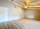Bright living space with light wood flooring, ceiling fan and fresh paint at 4030 Braesgate Ln, Tampa, FL 33624