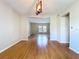 Open floor plan showcases hardwood floors and a view to the adjacent room at 4030 Braesgate Ln, Tampa, FL 33624