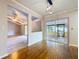Living room with hardwood floors, exposed beam ceiling, and access to the lanai at 4030 Braesgate Ln, Tampa, FL 33624