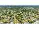 An aerial view of a quiet neighborhood with tree-lined streets and well-maintained homes at 4391 Ne Cherry Ne St, St Petersburg, FL 33703