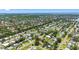 Scenic aerial of a waterfront community with lush greenery, serene lakes, and beautiful homes at 4391 Ne Cherry Ne St, St Petersburg, FL 33703