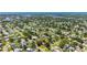 An aerial view of a quiet neighborhood with tree-lined streets and well-maintained homes at 4391 Ne Cherry Ne St, St Petersburg, FL 33703