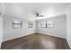 Bedroom features light gray walls, wood floors, a ceiling fan and three windows with lots of natural light at 4391 Ne Cherry Ne St, St Petersburg, FL 33703