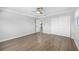 Spacious bedroom with wood floors, a ceiling fan, and natural light at 4391 Ne Cherry Ne St, St Petersburg, FL 33703