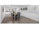 Dining room offers seating for six, neutral paint and floors and bright natural lighting at 4391 Ne Cherry Ne St, St Petersburg, FL 33703