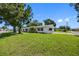 Well-maintained home with large yard, mature trees, and updated exterior at 4391 Ne Cherry Ne St, St Petersburg, FL 33703