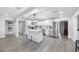 Beautiful kitchen with stainless appliances, bright lighting, and large island with seating at 4391 Ne Cherry Ne St, St Petersburg, FL 33703