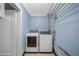 Laundry room with new, front-loading washer and dryer at 4391 Ne Cherry Ne St, St Petersburg, FL 33703