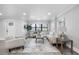 Comfortable living room features neutral paint and furnishings, plus updated flooring and recessed lighting at 4391 Ne Cherry Ne St, St Petersburg, FL 33703