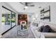 Living room features a large sliding glass door, built in bookshelf and stylish decor and lots of natural light at 4391 Ne Cherry Ne St, St Petersburg, FL 33703