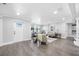 Inviting living room with modern furniture, open floor plan, and lots of natural light at 4391 Ne Cherry Ne St, St Petersburg, FL 33703