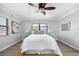 Main bedroom with lots of natural light, light gray walls and light-colored floors and a modern ceiling fan at 4391 Ne Cherry Ne St, St Petersburg, FL 33703
