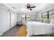 Main bedroom featuring a ceiling fan, walk in closet, window and light gray walls and light-colored floors at 4391 Ne Cherry Ne St, St Petersburg, FL 33703