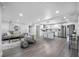 Spacious open-concept living area with white kitchen, stainless steel appliances, and modern finishes at 4391 Ne Cherry Ne St, St Petersburg, FL 33703