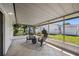 Covered porch with tile flooring and a view of the outdoor greenery at 4391 Ne Cherry Ne St, St Petersburg, FL 33703