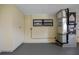 Utility room featuring a well-maintained HVAC system, storage cabinets, and a window for natural light at 4391 Ne Cherry Ne St, St Petersburg, FL 33703