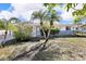 Charming single-story home with lush landscaping and curb appeal at 525 Skylark Nw Ln, Port Charlotte, FL 33952