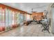 Expansive living area featuring tile floors, and access to the patio at 525 Skylark Nw Ln, Port Charlotte, FL 33952