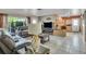 Bright living area with tile flooring, large window, and seamless flow to the kitchen at 525 Skylark Nw Ln, Port Charlotte, FL 33952